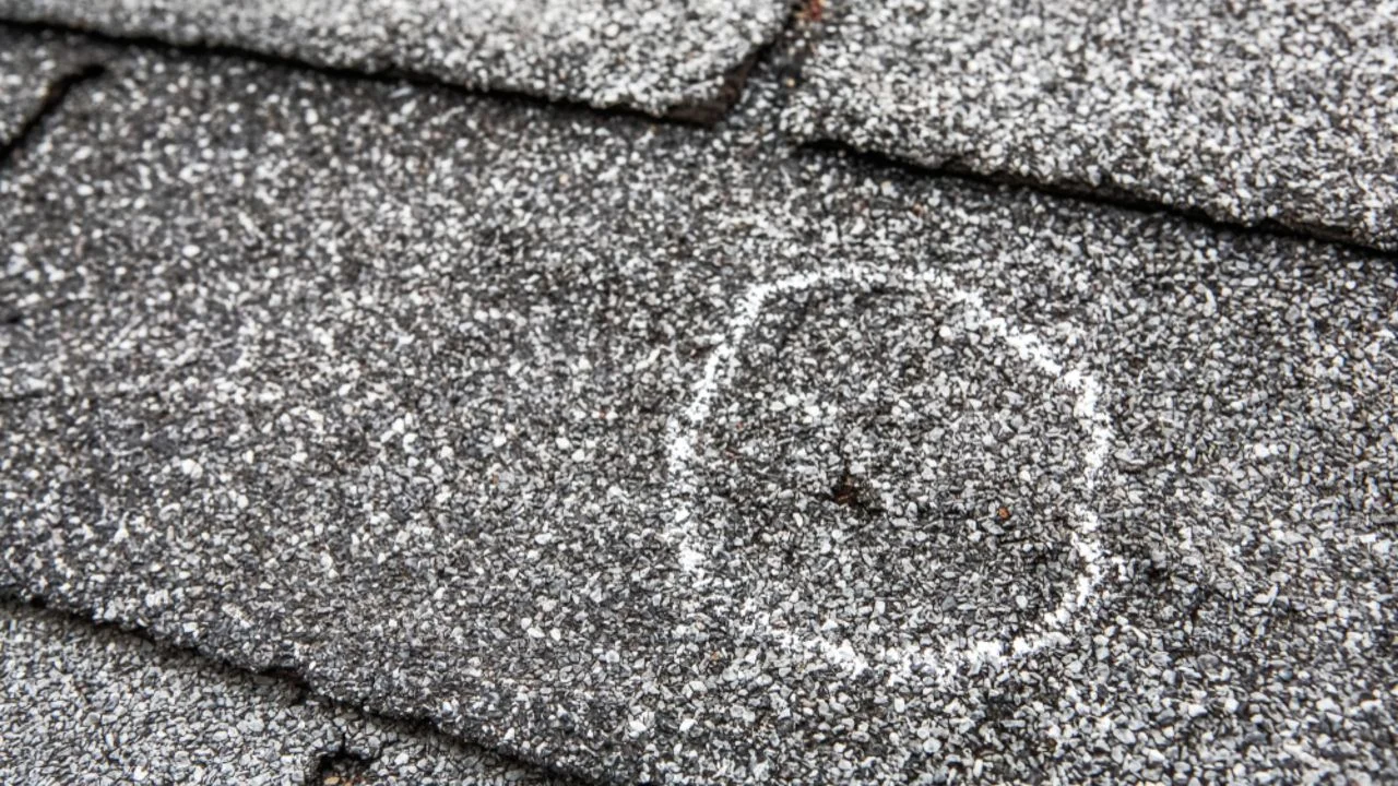 Storm damaged roof before repair