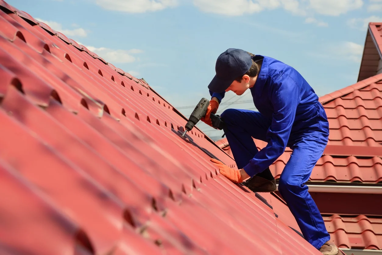 Tile roof installation with worker